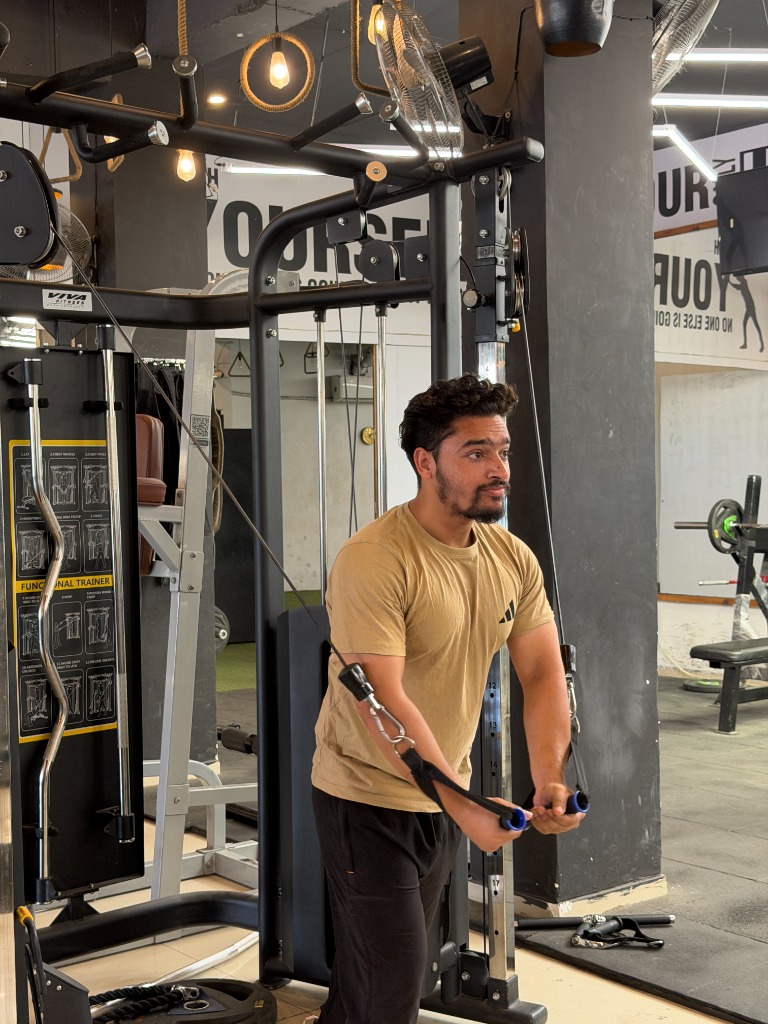 Member doing cable flys at Addiction Fitness Factory